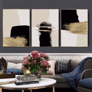 3 tableaux en beige avec du doré et noir
